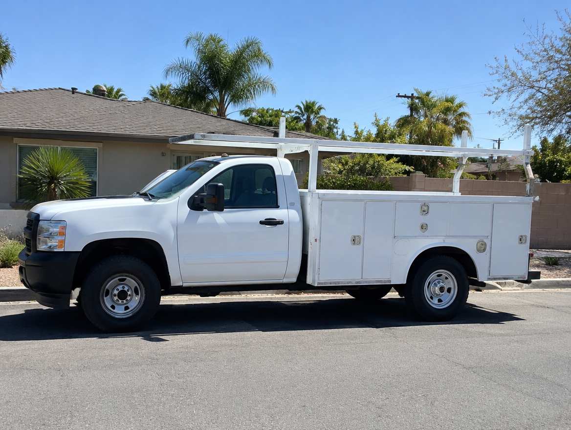 An unmarked plumbing service van parked at a home in Anaheim, California