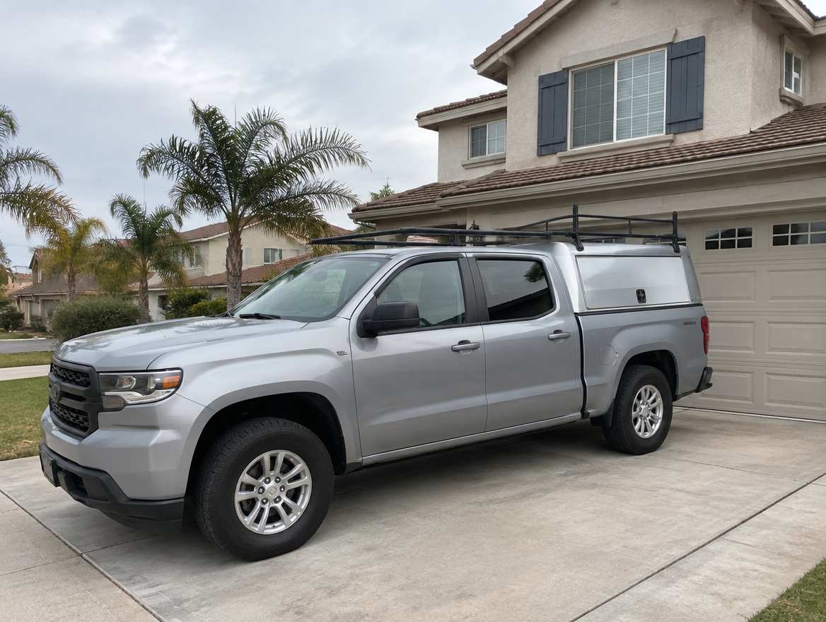 An unmarked plumbing service van parked at a home in Fullerton, California