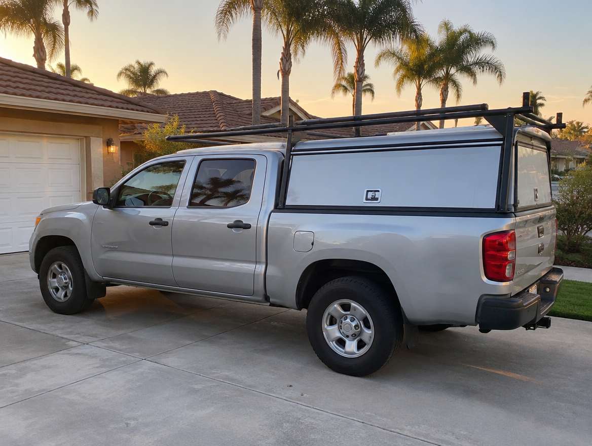 An unmarked plumbing service van parked at a home in Fullerton, California