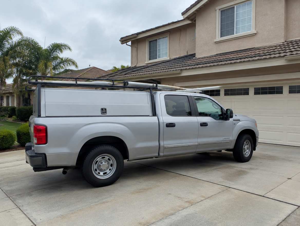 An unmarked plumbing service van parked at a home in Fullerton, California